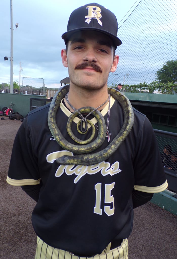 Aidan Henderson, wearing Broken Arrow baseball's victory snake, was the winning pitcher in the Tigers' 5-2 win at Owasso on April 27, 2023.